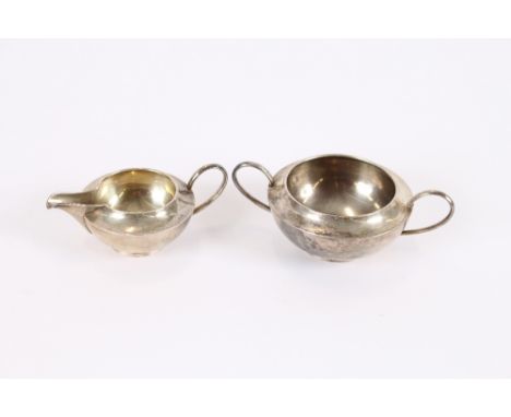 An Edwardian silver sucrier, and matching cream jug, Chester 1907, (2)