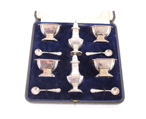 A cased matched silver four piece cruet, by Elkington & Co., London 1919 and 1926, with associated spoons