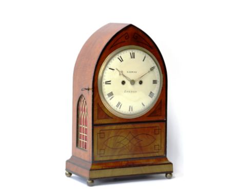 A Regency mahogany cased bracket clock, by John Barwise, the ebony strung lancet shaped case enclosing a circular painted Rom