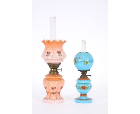 A Victorian pink tinted opaque glass table lamp, with frilled shade above baluster base, 26cm high overall; and a blue opaque
