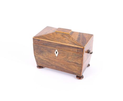 A Regency rosewood sarcophagus shaped tea caddy, (interior missing), and contents to include a tortoise shell ivory and white