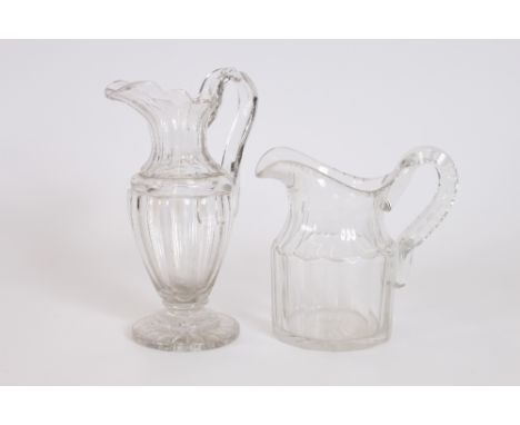A pair of 19th Century triple ring neck decanters, (odd stoppers); a cut glass ship's decanter and two heavy glass water jugs