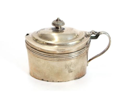 A George III silver oval mustard pot, indistinctly marked, probably London late 18th Century, the domed lid with engraved cre