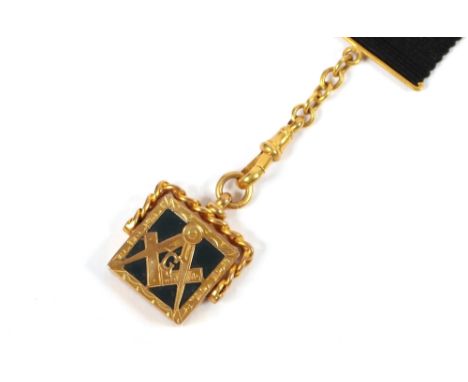 A 9ct gold and enamel decorated Masonic order, hung to a clasp and black silk attachment 