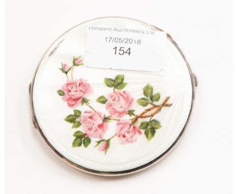 An Elizabeth II silver mounted enamel compact, engine turned base, the cover with white radial enamel painted with pink roses
