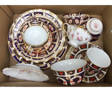 A collection of Royal Crown Derby, comprising Imari 1128 pattern cup, saucer, dessert plate and sugar bowl 2451 trio 1298 tri