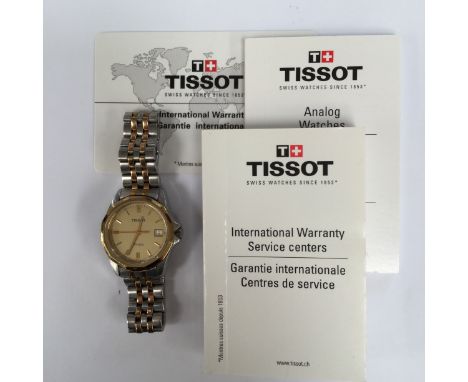 A ladies Tissot stainless steel wristwatch, with gold tone dial with steel and gold plated detail to the strap, case diameter