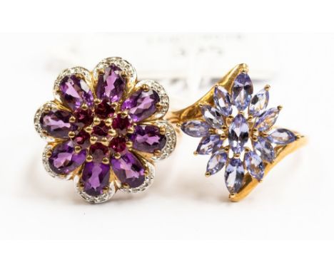 Two 9ct gold dress rings, comprising one set with marquise shaped tanzanite's, size S1/2, the other set with amethyst and gar