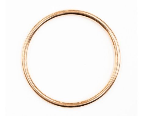 A 9ct rose gold slave bangle, round hollow section, internal diameter approx 68mm, with a total gross weight approx 8.4gms