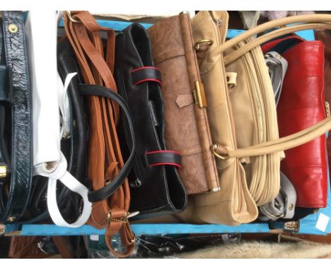A collection of various style handbags to include: 2 putty coloured Totes 1980's. 1 Large Brown late 1950's. Brown bag. Black