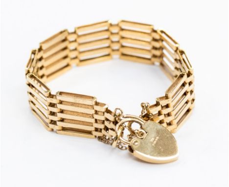 A 9ct gold gate link bracelet, width approx 15mm,  with padlock clasp,  weighing approx 18.7 grams 