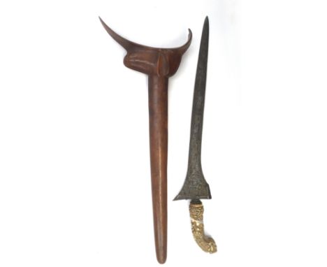  A Malaysian kris dagger, 19th Century or earlier, carved ivory hilt, damascus steel blade, length 32cm, treen scabbard,