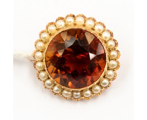 A citrine and seed pearl brooch, set with round citrine with pearl surround in yellow metal, approx 6.8gms