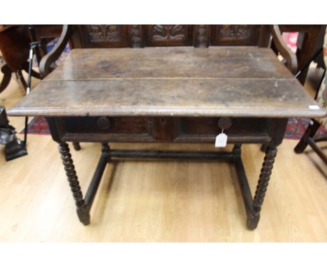 A late 17th Century and later joined oak side table, fitted with a single drawer, bobbin turned supports, 70cm high, 102cm wi