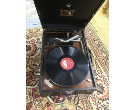 A vintage circa 1930s record player, HMV wind up, black cased, portable with Max Bygraves record, working order