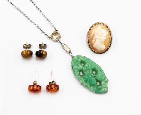 An Art Deco Jade style glass pendant, a pair of Tigers Eye earrings, a pair of amber earrings and a continental silver .800 c
