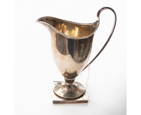 A silver helmet shaped cream jug on pedestal base, Chester hallmark 1917, with retailers item tags, 128 grams approx, Oxford 