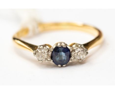 A sapphire and diamond three stone ring, claw set in yellow metal, probably 18ct gold, size K,  with a total gross weight app