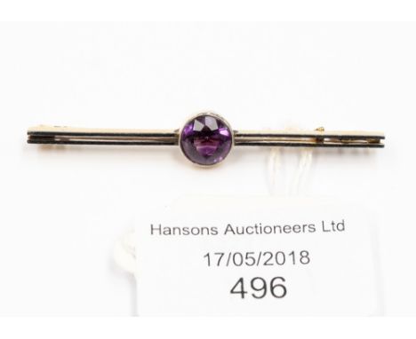 An Art Deco amethyst bar brooch, with round cut amethyst, approx size 8mm, set in yellow metal probably 15ct gold with platin