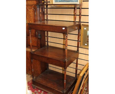 A George IV mahogany four tier whatnot, circa 1830, the top shelf set back, on turned baluster supports, 151cm high, 61cm wid
