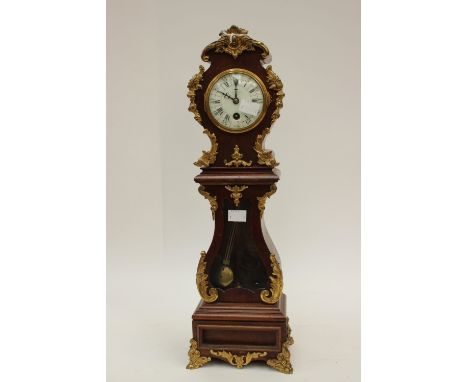 A 19th Century French clock with applied brass decoration, retailed by London firm, modelled as an 18th Century long case clo