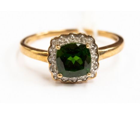 A tourmaline and diamond ring, comprising a cushion shaped stone, with a diamond surround, set in 9ct gold, size S, with a to
