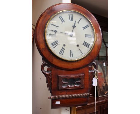 A wall clock, Roman numerals to dial, visible pendulum, mahogany case 
