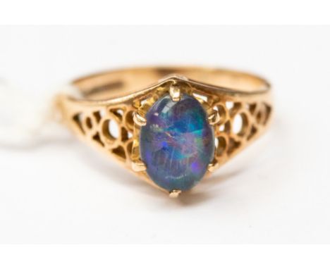 A 9ct gold ring set with a oval triplet opal, with open mount, size K, with a total gross weight approx 2.6gms