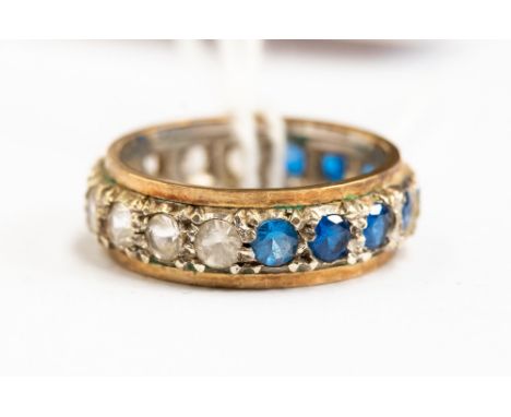 A full eternity ring set with half  blue and white stones, size K 1/2, with a total gross weight approx 4.2gms