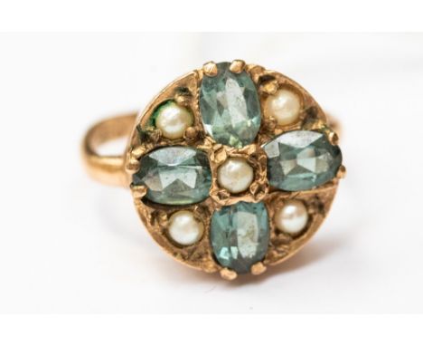 A Victorian 9ct ring, set with green stones possibly tourmaline and seed pearls, round head set with four oval stones inters 