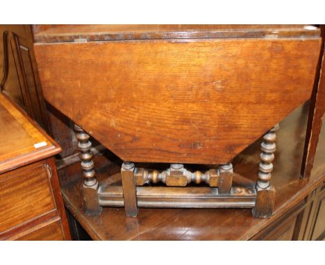 A Carolean style oak joined credence table, raised on bobbin turned legs, 50cm high, 60cm wide, 32cm deep