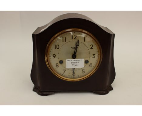 A Smiths Enfield bakelite eight day mantle clock, complete with pendulum and key