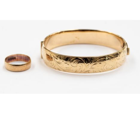 A 9ct gold bangle with a 9ct gold wedding band, total weight approx 30.6 grams (2) 
