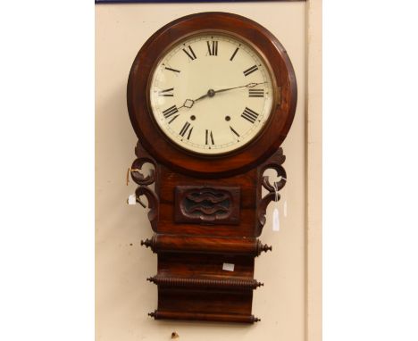 A 19th Century mahogany wall clock, Roman numerals, key and pendulum 
