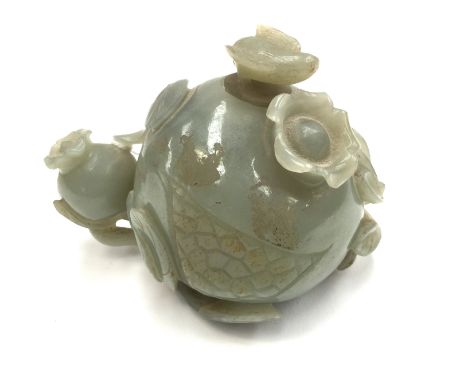 A Chinese jade water pot and stopper, probably 19th Century, carved as a pomegranate on a sprig beside another smaller fruit 