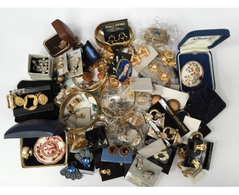 A large collection of costume clip on earrings in a variety of styles including paste set and enamel versions, gilt types, gi