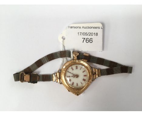An unusual shaped watch 18k gold, converted to wristwatch from fob watch, World War One circa, enamel dial with Roman numeral