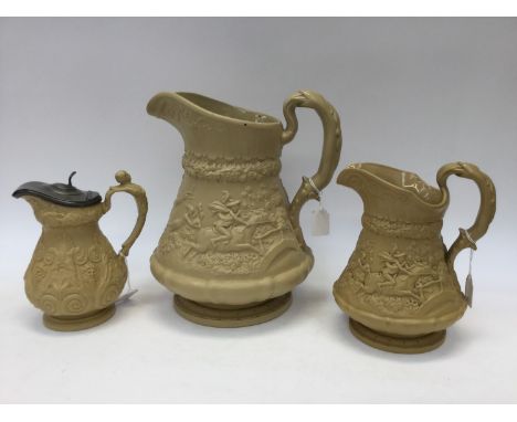 A large, Staffordshire relief moulded jug, Ridgway, Tam o Shanter design, together with similar smaller and another with pewt