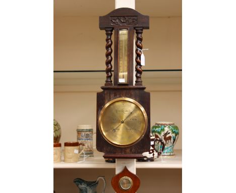 An early 20th Century oak barometer and thermometer by H Miller Optician 