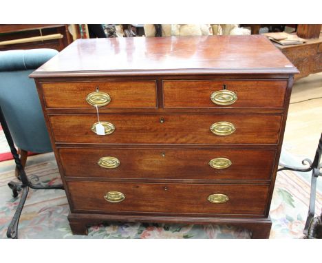 A George III mahogany chest of drawers, comprising two short over three long graduated drawers, raised on bracket feet, 92cm 