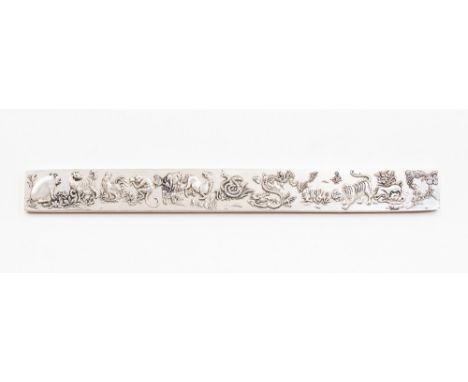 A Chinese silver ruler chased with symbols of calender