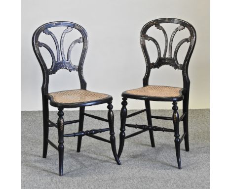 A pair of 19th century mother of pearl inlaid black lacquered side chairs, with cane seats