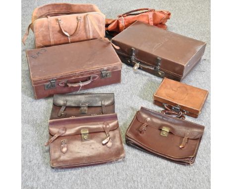 A collection of vintage luggage, largest 61cm