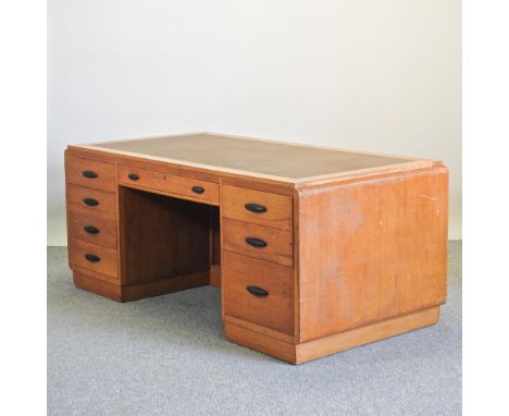 A mid 20th century light oak pedestal desk, 183cm