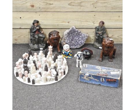 A cast iron doorstop, together with a chess set, carvings and an amethyst and metalwares