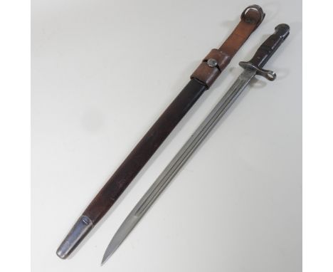 An early 20th century 1913 pattern Remington bayonet, with a wooden handle, in a leather scabbard, 60cm long overall