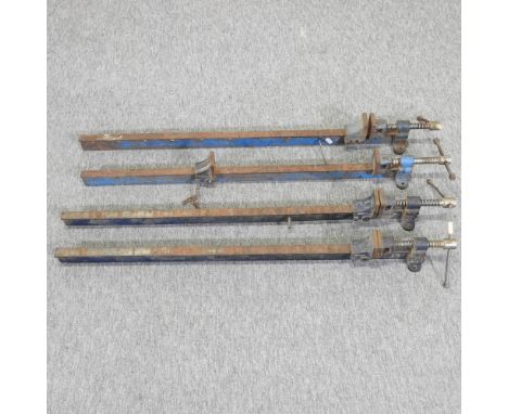 A set of four metal sash cramps, largest 93cm