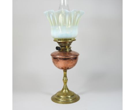 An Arts and Crafts brass oil lamp, by WAS Benson, stamped marks, with a vaseline glass shade, 163cm high