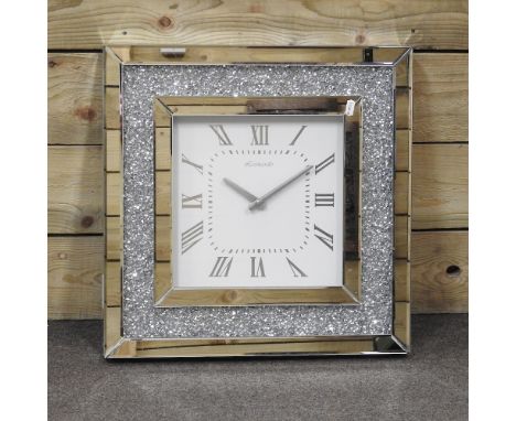 A modern mirrored clock, 50cm wide