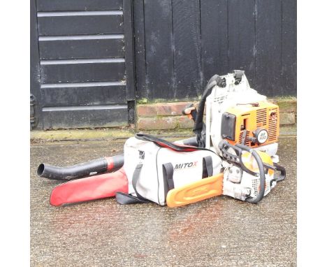 A Stihl petrol driven chainsaw, together with a petrol driven garden leaf blower